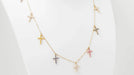 Collier CARTIER - Collier 11 Croix en or rose diamants et saphirs de couleurs 58 Facettes 32788