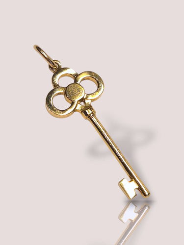 Collier Collier en or jaune 18 carats Tiffany & Co avec pendentif clé en or et diamant 58 Facettes 11114