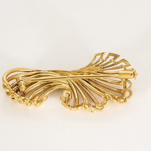 Broche Broche en or jaune à motif de volutes ajourées 58 Facettes SAI03673