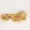 Broche Broche en or jaune à motif de volutes ajourées 58 Facettes SAI03673