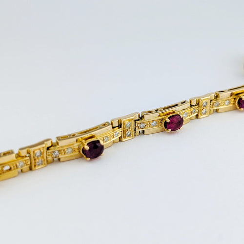 Bracelet Bracelet en or jaune 18 carats, diamants et rubis 58 Facettes 33374