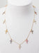 Collier CARTIER - Collier 11 Croix en or rose diamants et saphirs de couleurs 58 Facettes 32788