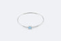 Bracelet Oro Bianco Bracciale rigido in oro bianco con topazio azzurro e zirconi 58 Facettes 197,00 BRC