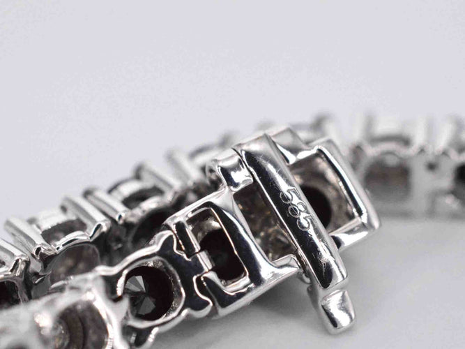 Bracelet Bracelet de tennis en or blanc serti de diamants noirs et blancs 58 Facettes 2119