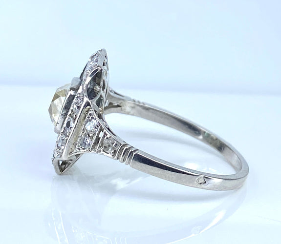 Art Deco cushion ring in platinum and diamonds, emeralds 