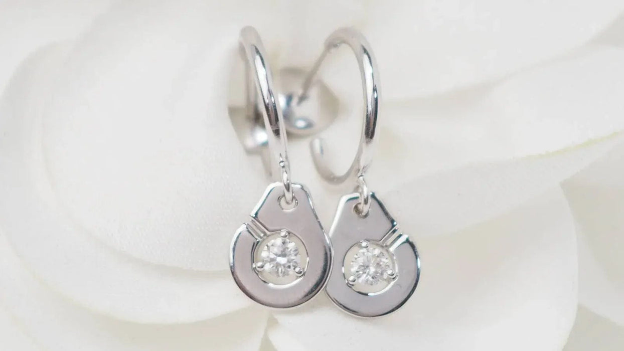 Boucles d'oreilles DINH VAN - Boucles d'oreilles menottes en or blanc et diamants 58 Facettes 32912