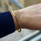 Bracelet Bracelet jonc ouvrant grand modèle en or jaune 18k 58 Facettes