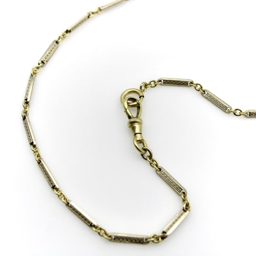 Montre Chaîne de montre Art Déco bicolore en or 10 carats avec fermoir mousqueton et anneau à ressort en or 14 carats 58 Facettes A20057