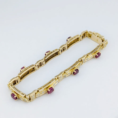 Bracelet Bracelet en or jaune 18 carats, diamants et rubis 58 Facettes 33374