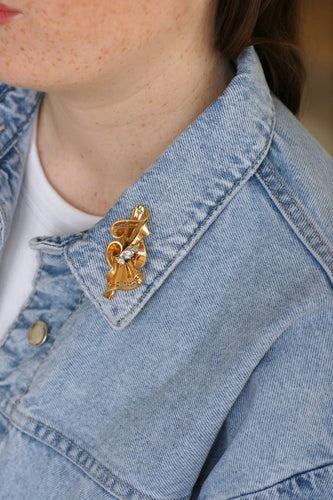 Broche Broche noeud or rose, platine et diamants 58 Facettes