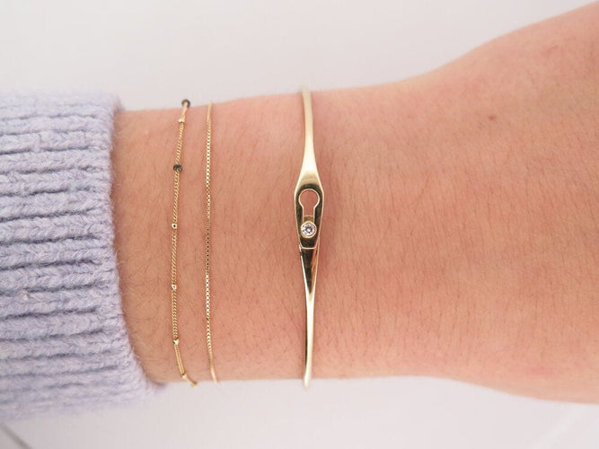 Bracelet bracelet DINH VAN serrure jonc 334106 16.5 en or jaune 18k diamant 58 Facettes 267592