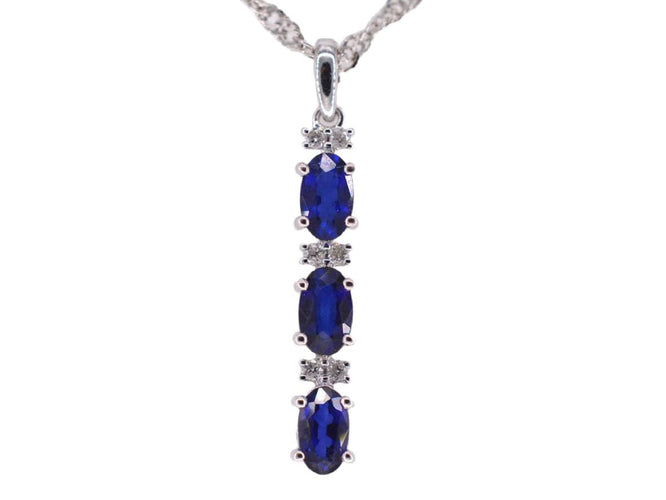 Pendentif Pendentif en or blanc avec diamants et saphir 58 Facettes 2136