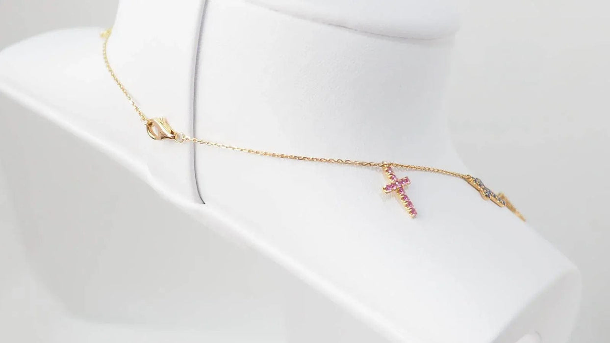 Collier CARTIER - Collier 11 Croix en or rose diamants et saphirs de couleurs 58 Facettes 32788