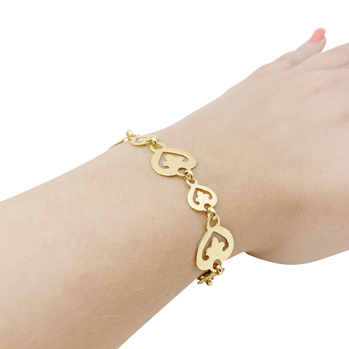 OJ Perrin “Heart Legend” bracelet in yellow gold.
