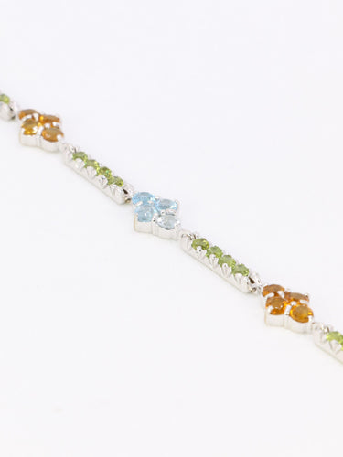 Bracelet Bracelet ligne or blanc citrines péridots topazes bleues 58 Facettes 1CA0000006/1
