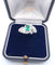 Bague 51 Bague en or blanc 18 carats avec émeraude centrale et diamants environnants 58 Facettes
