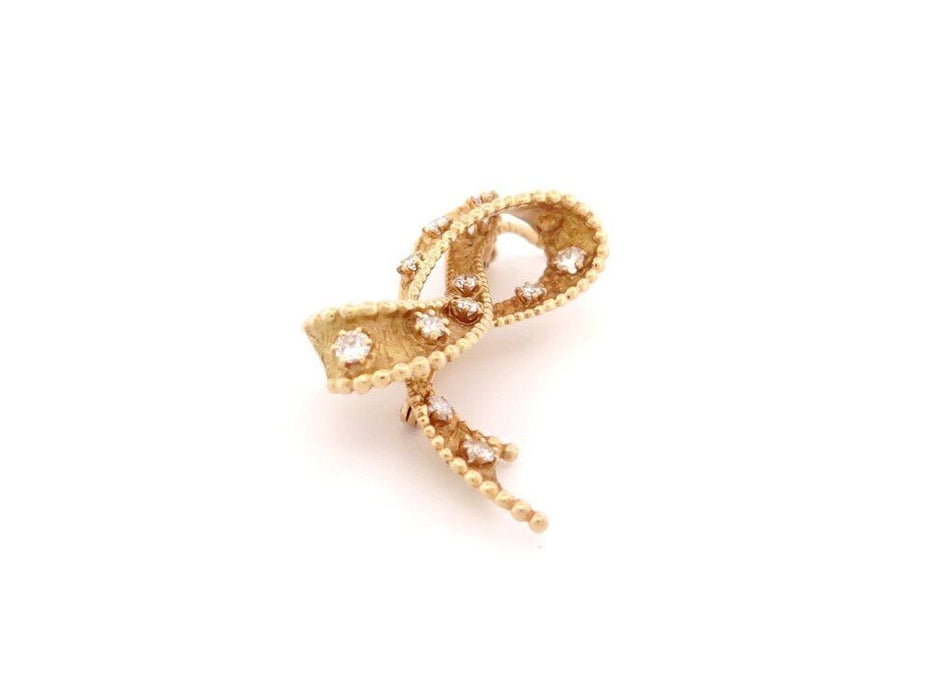 Broche vintage broche noeud sertie de 15 diamants 1.3 ct or jaune 58 Facettes 264002