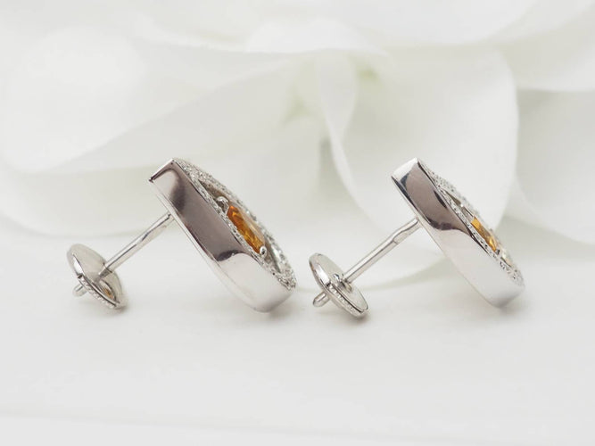 Boucles d'oreilles Boucles d'oreilles en or blanc, citrines et diamants 58 Facettes 32804 b