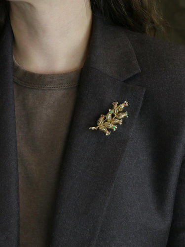 Broche GUBELIN Broche feuille or rubis émeraudes 58 Facettes 1126.1