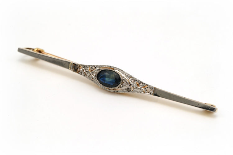 Broche Broche art déco en or jaune et blanc serti d'un saphir et de diamants 58 Facettes B314