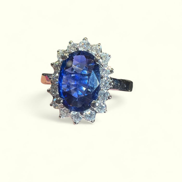 white gold sapphire ring surrounded by diamonds