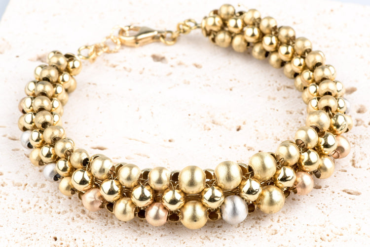 Bracelet Bracelet boules en trois ors 18k or jaune, blanc et rose 58 Facettes BRBLECC1325-107