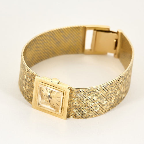 Montre OMEGA - Montre bracelet de dame 2 tons d'or (750) satiné, de forme carrée à mouvement mécanique. 58 Facettes RAM3009