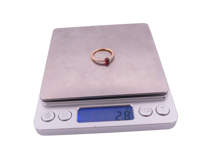 Bague 53 bague POMELLATO m'ama non m'ama grenat 53 diamants or jaune 18k 58 Facettes 268365