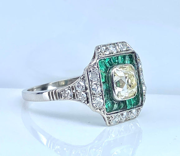 Art Deco cushion ring in platinum and diamonds, emeralds 