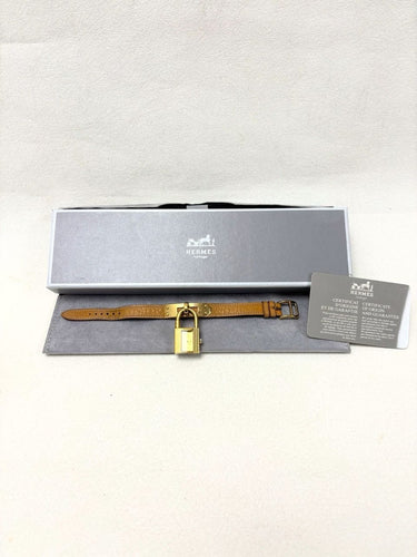 Montre Hermès - Montre Kelly en plaqué or, bracelet cuir camel 58 Facettes WC-2025-2302