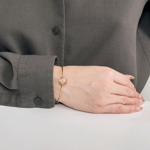 Bracelet Bracelet jonc rigide ouvrant or jaune et cabochon quartz rose 58 Facettes EVR2571