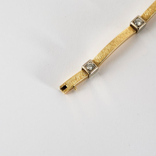 Bracelet Bracelet moderniste en or jaune et gris, et diamants 58 Facettes MEA43045