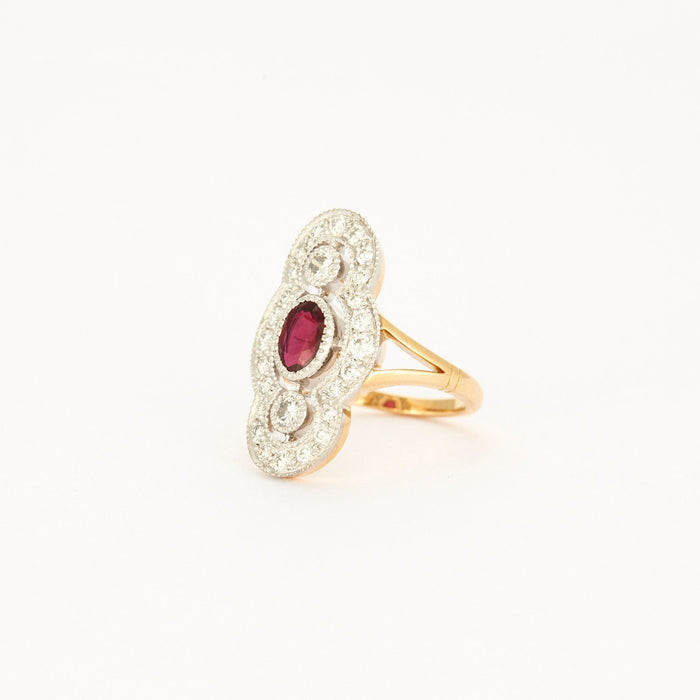 Art Deco Style ring in yellow gold, platinum, diamonds and ruby center