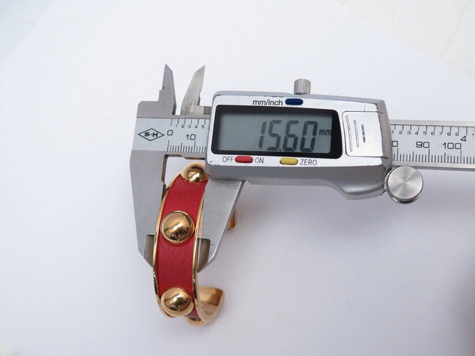 Bracelet bracelet HERMES jonc en cuir rouge et metal dore red  en 58 Facettes 272251