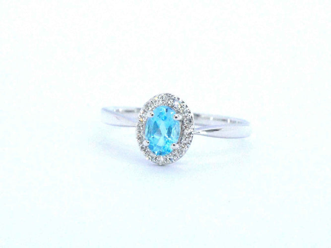 Bague Bague en or blanc avec une topaze bleue et des diamants naturels 58 Facettes 2367