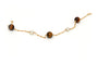 Bracelet Bracelet contemporain en or jaune, perles et œil de tigre 58 Facettes 13428