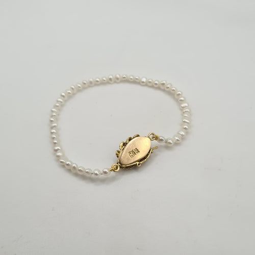 Bracelet Bracelet or jaune 14 carats serti de perles et pierre verte 58 Facettes