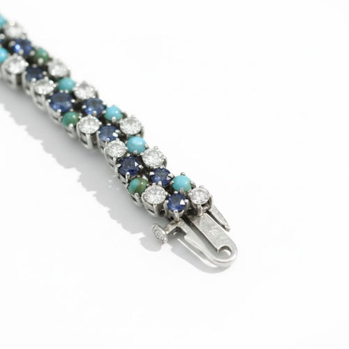 Montre Uti - Montre Ovale - Or Blanc - Diamants, Saphirs et Turquoise 58 Facettes 1.0001001/1