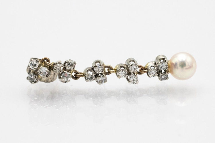 A unique pair of earrings with pearls and diamonds. 