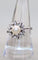 Bague 59 Bague marguerite or blanc, perle centrale, diamants 58 Facettes