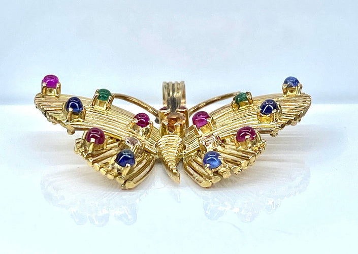 Pendente a farfalla in oro giallo e pietre preziose 