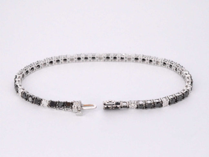Bracelet Bracelet de tennis en or blanc serti de diamants noirs et blancs 58 Facettes 2119