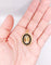 Pendentif Pendentif porte photo antique or rose 18k miniature demoiselle et onyx (circa 1900) 58 Facettes A05940