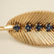 Broche Van Cleef & Arpels - Broche Feuille - Or jaune et Platine - Saphirs et Diamants 58 Facettes 1.0001076/1