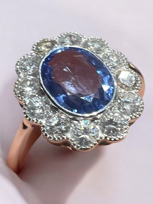 white gold ring with sapphire and brilliant surround