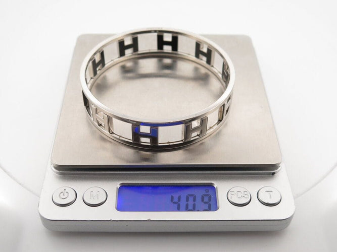 Bracelet bracelet HERMES rondo ash h rotatifs 20cm acier paladie & laque noir 58 Facettes 264585