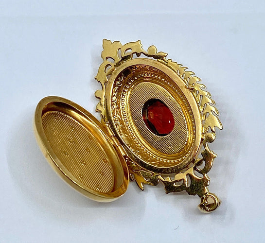 Pendentif Pendentif porte souvenir ouvrant en or et grenat 58 Facettes AB574