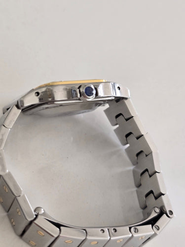 Montre Cartier - Montre Santos Galbée en acier et or jaune 58 Facettes