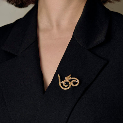 Broche Broche en or jaune à motif de volutes torsadées 58 Facettes COMP0987