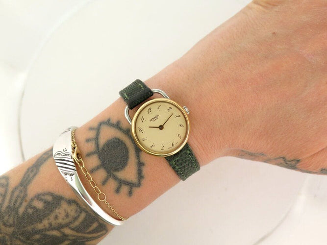 Montre vintage montre HERMES arceau plaque or 25 mm bracelet lezard quartz lady 58 Facettes 267938